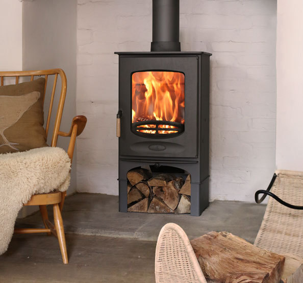 Charnwood ceight fire on log store at fire by design in dorset  hampshire. fireplace shop