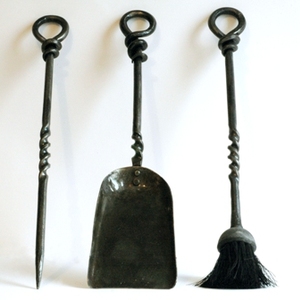 Twisted fire irons wall hung
